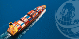 Cargo ship transporting containers over the ocean.