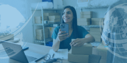 Lady looking at her mobile phone and dealing with parcels
